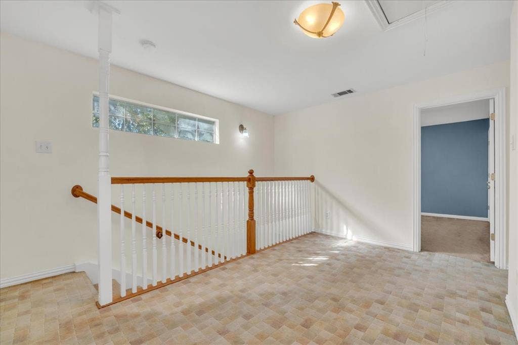 Landing space at the top of the stairs creates an additional space for a home office, flex space, additional living space, etc.