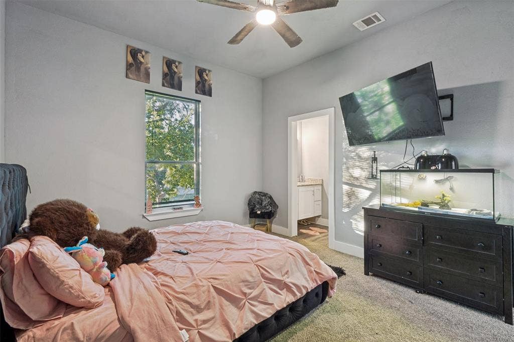 7909 Ivory Lane, Dallas, TX 75216 Neutral-toned interior featuring carpeted flooring, a ceiling fan with light fixture, and a window with blinds