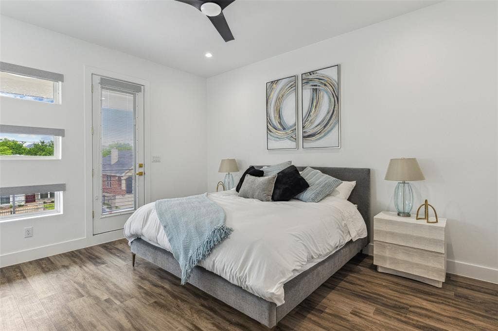 Bedroom with ceiling fan and dark hardwood / wood-style flooring