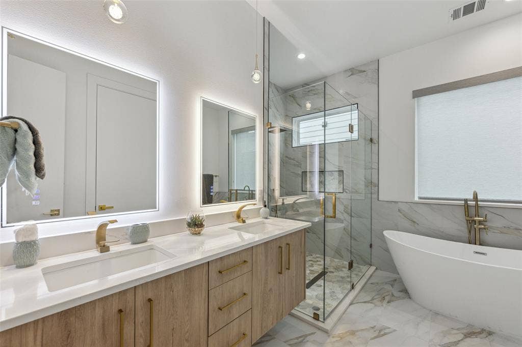 Bathroom with plus walk in shower, tile patterned flooring, and vanity