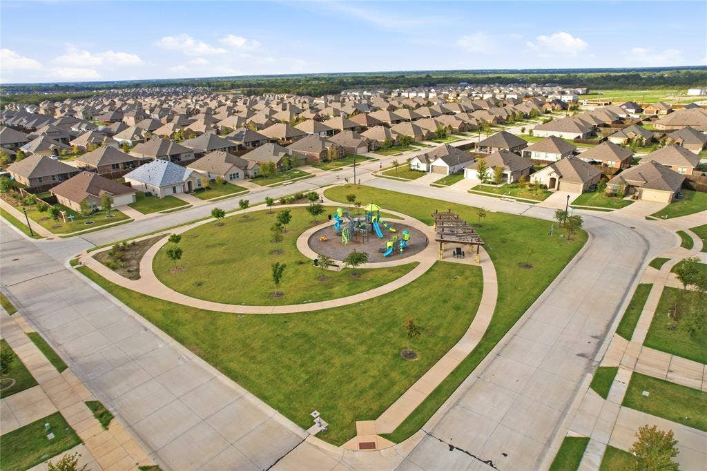 1108 Emerald Gate Drive, Princeton, TX 75407 Community park featuring a central playground, covered pavilion, paved walking paths, and manicured green space