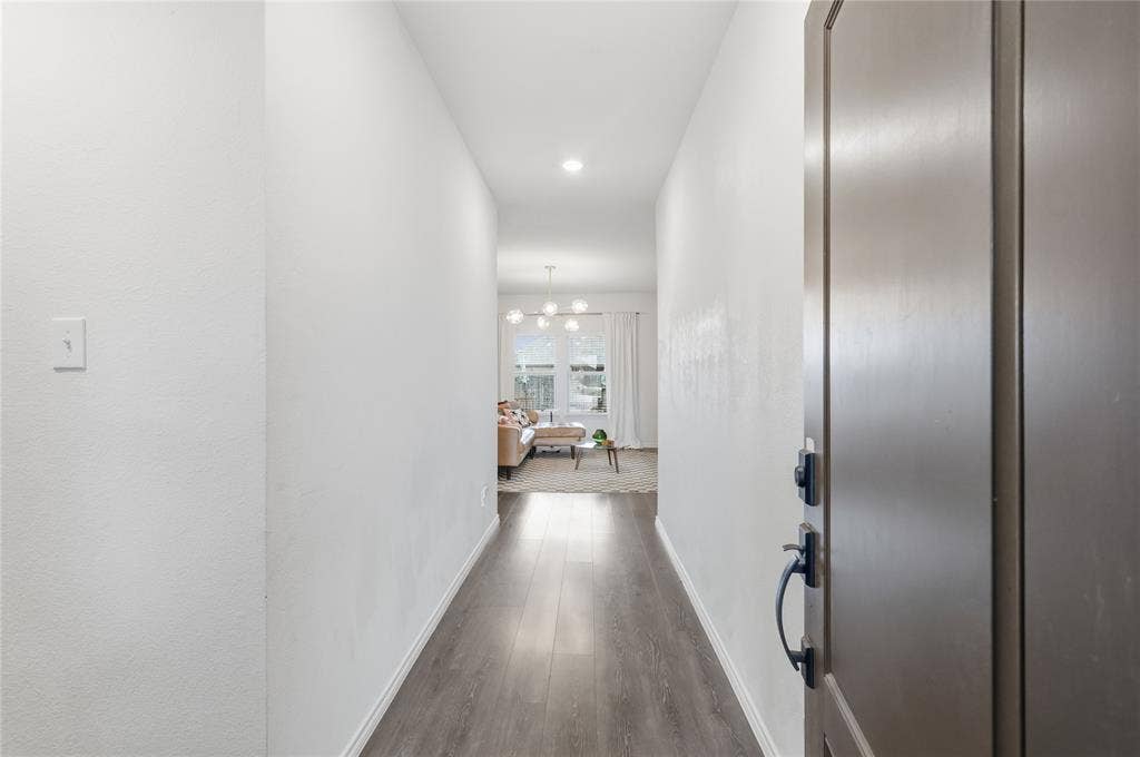 1108 Emerald Gate Drive, Princeton, TX 75407 Entryway featuring wood-finish flooring, neutral walls, recessed lighting, and a dark-finish entry door with a lever handle and electronic deadbolt