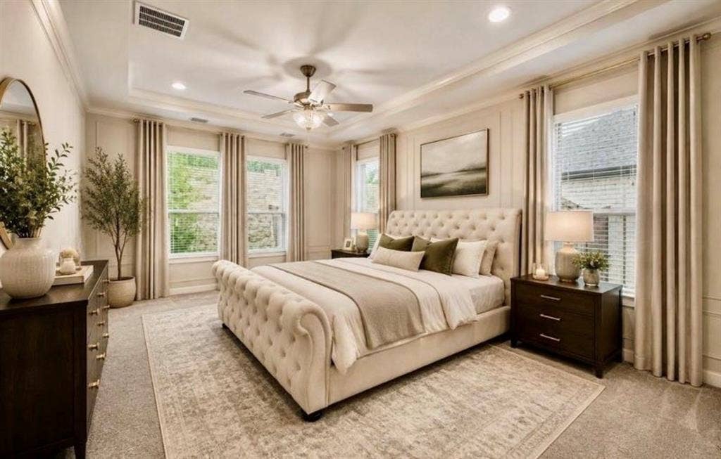 Tray ceiling with recessed lighting, crown molding, wall paneling, and ceiling fan with integrated light fixture