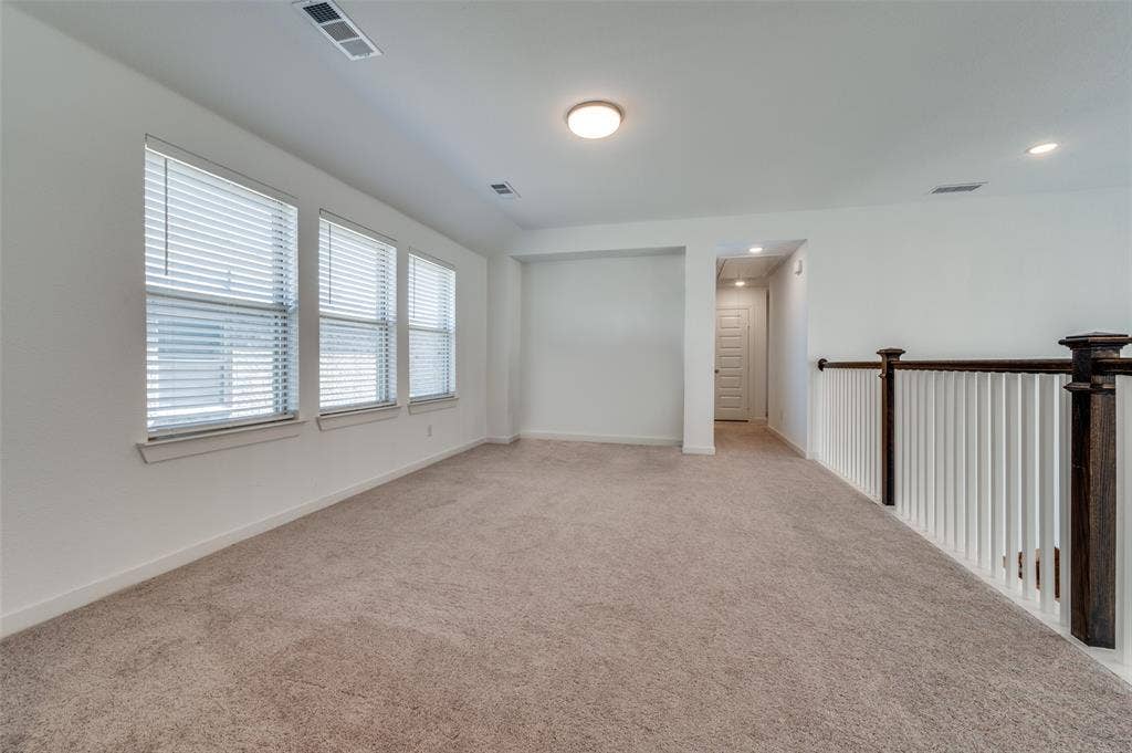 1520 Gelding Drive, Aubrey, TX 76227 Carpeted spare room featuring baseboards and recessed lighting