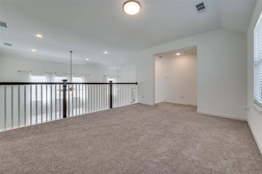 1520 Gelding Drive, Aubrey, TX 76227 Spare room featuring light carpet and recessed lighting
