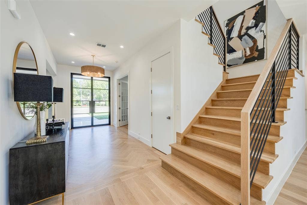 Gorgeous solid white oak hardwood floors throughout with herringbone entry.
