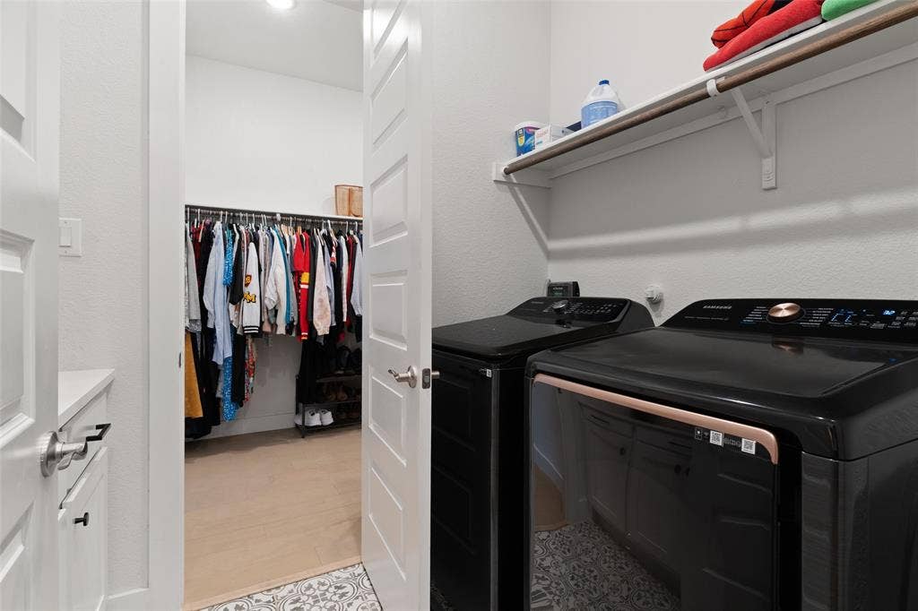 Laundry room with access from Primary closet