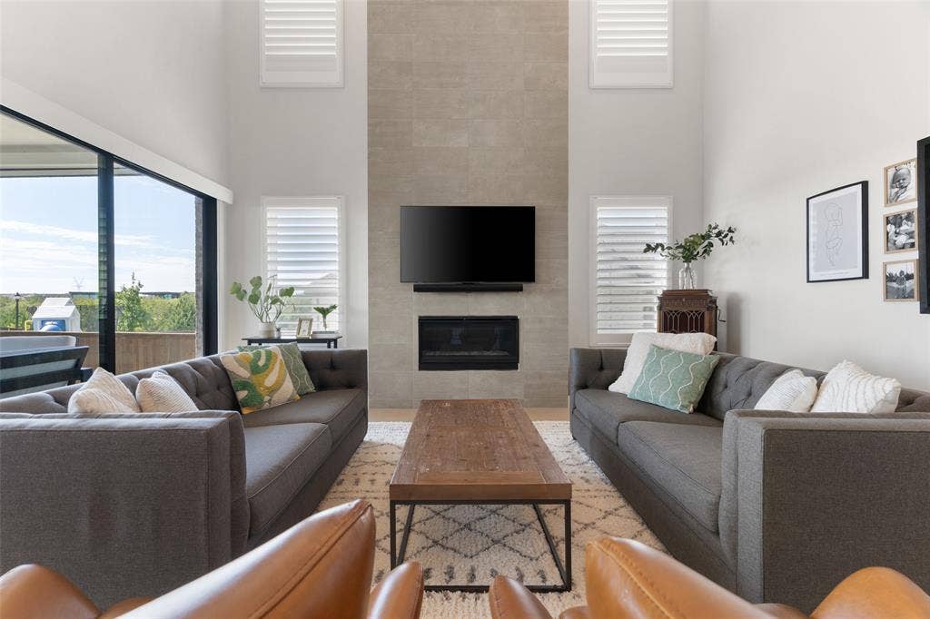 Living Room with dramatic floor to ceiling fireplace