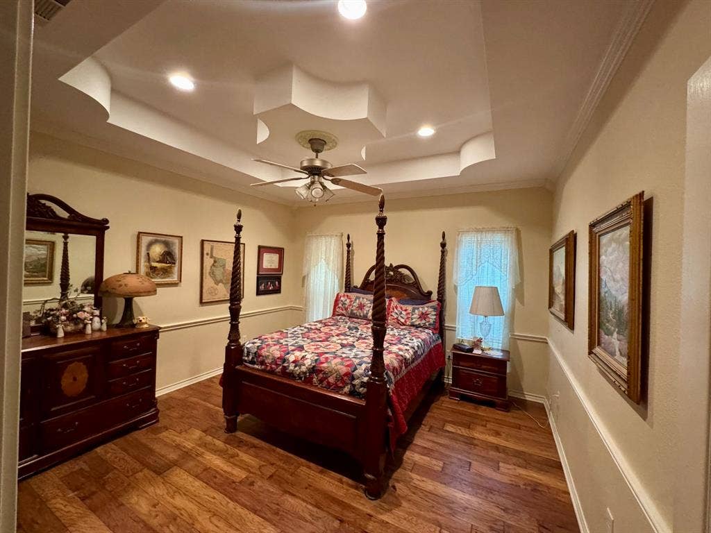 3700 NE County Road 0095, Corsicana, TX 75109 Tray ceiling with recessed lighting, wood-finish flooring, and chair rail molding
