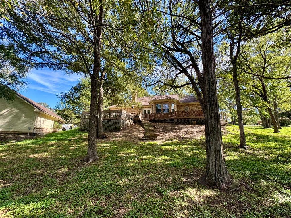 3700 NE County Road 0095, Corsicana, TX 75109 Back of the Second garage is the yellow struture to the left