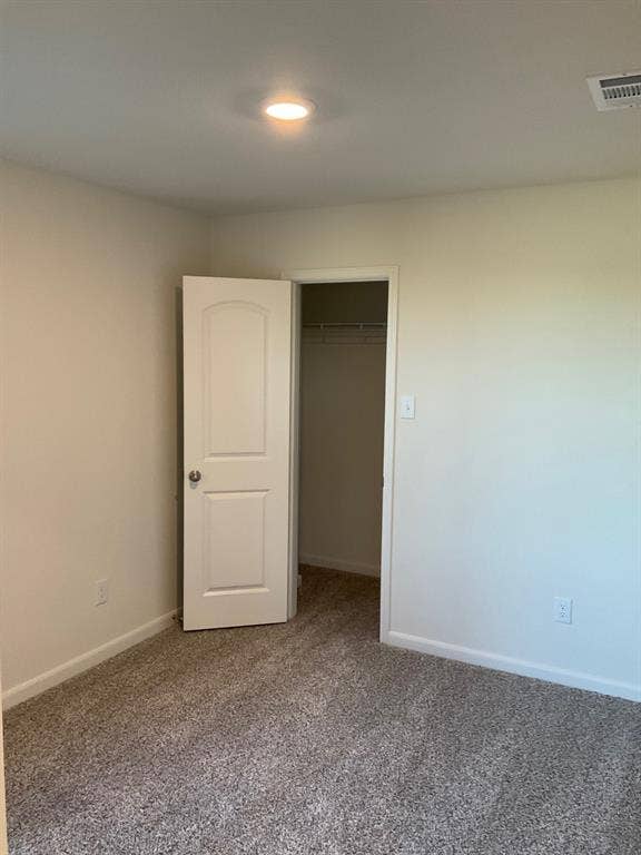 325 Stone Court, Princeton, TX 75407 Neutral-toned carpeting, recessed ceiling lighting, and a two-panel interior door opening to a closet with built-in wire shelving