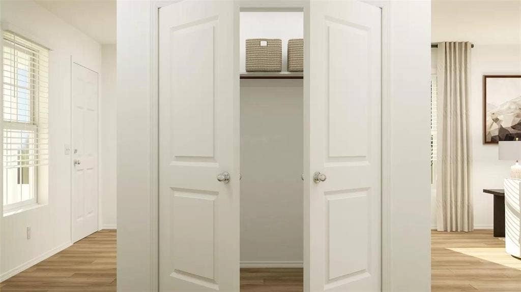 116 Radish Road, Princeton, TX 75407 Double-door closet featuring a built-in shelf, metal hanging rod, and wood-finish flooring throughout