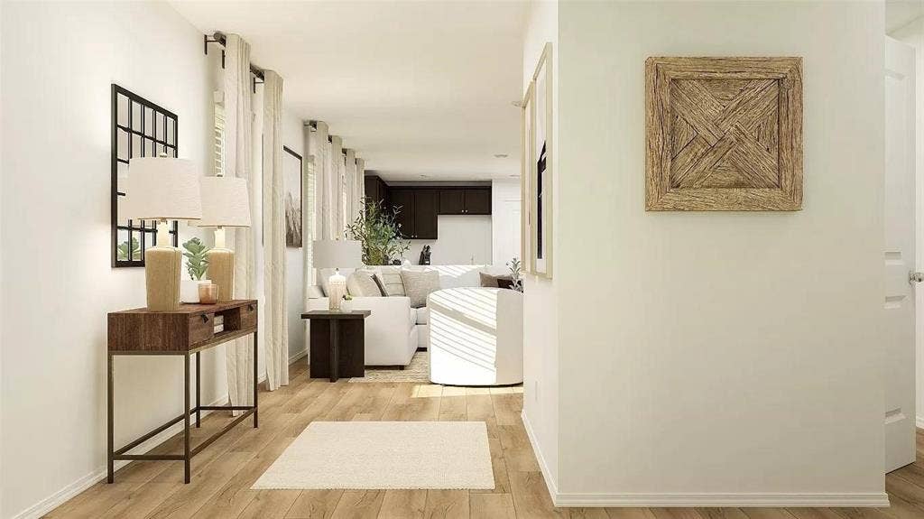 116 Radish Road, Princeton, TX 75407 Neutral-toned walls paired with continuous wood-finish flooring throughout the interior