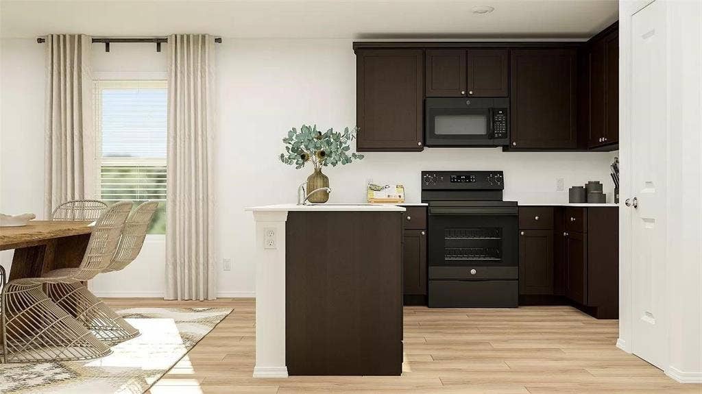 116 Radish Road, Princeton, TX 75407 Kitchen featuring dark cabinetry, matching black appliances, central island, and wood-finish flooring