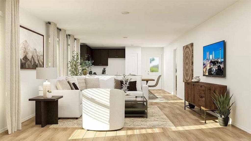116 Radish Road, Princeton, TX 75407 Open-concept interior featuring wood-finish flooring, recessed lighting, and large windows with full-length drapery