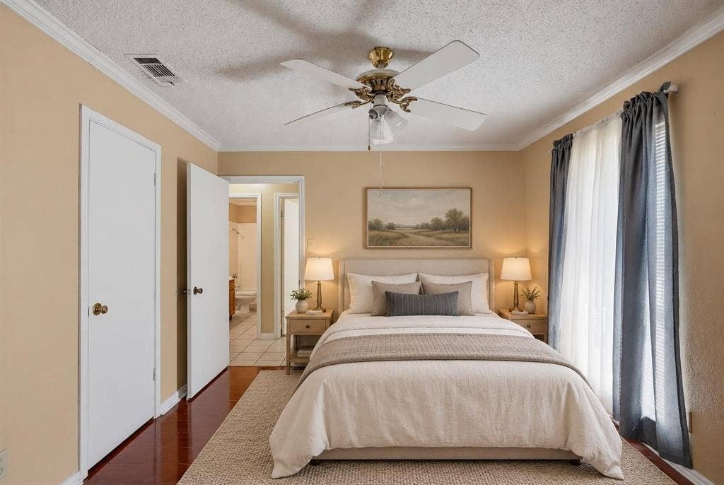 Room featuring polished hardwood flooring, crown molding, and a central ceiling fan with an integrated light fixture