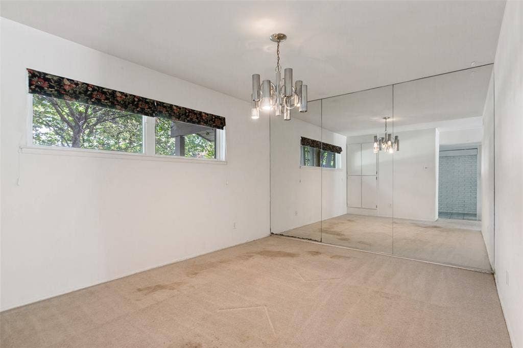 12515 Cedar Bend Drive, Dallas, TX 75244 Dining area with mirrored wall off the foyer.