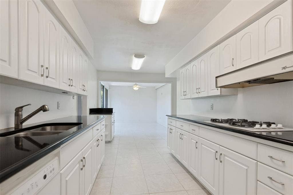 12515 Cedar Bend Drive, Dallas, TX 75244 Galley kitchen with lots of storage.