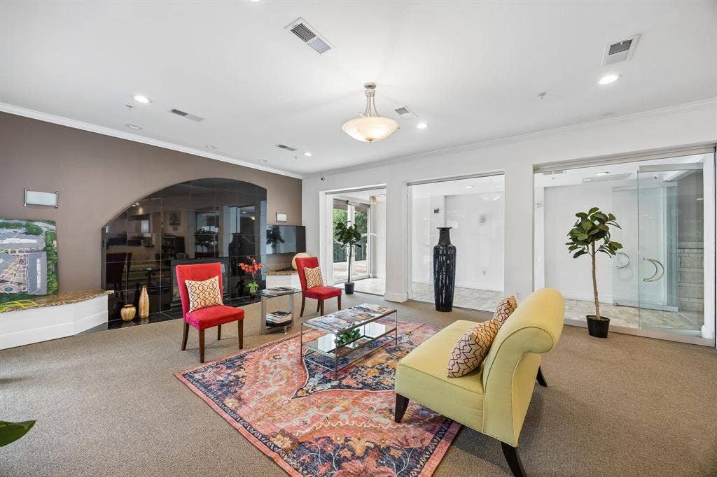 Spacious interior featuring recessed lighting, crown molding, and glass partitions