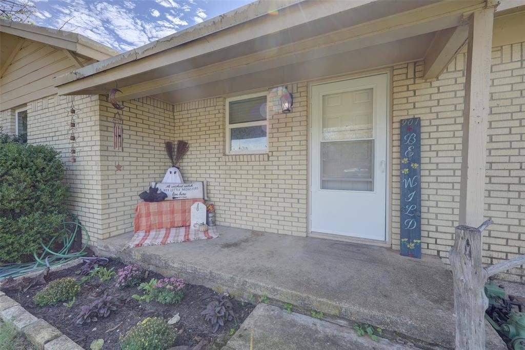 901 Elizabeth Boulevard, Granbury, TX 76048 Large covered front porch makes everyone feel welcomed