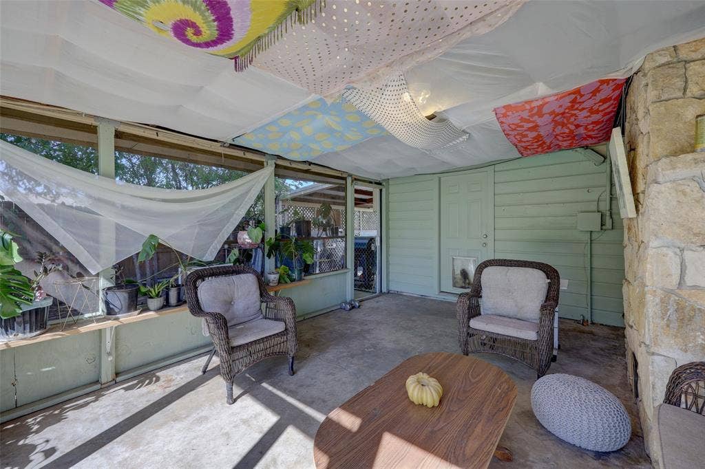 901 Elizabeth Boulevard, Granbury, TX 76048 Large screened-in covered patio with retractable screen door to carport