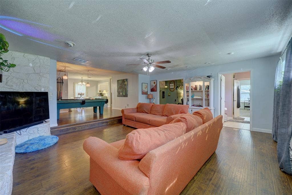 901 Elizabeth Boulevard, Granbury, TX 76048 Primary bathroom and bedroom are accessed from the living room
