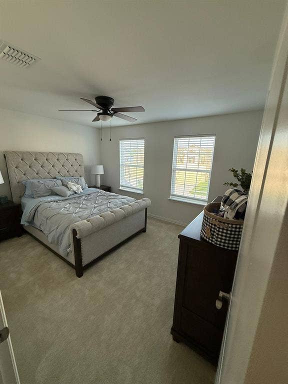 Bedroom featuring carpet flooring and ceiling fan