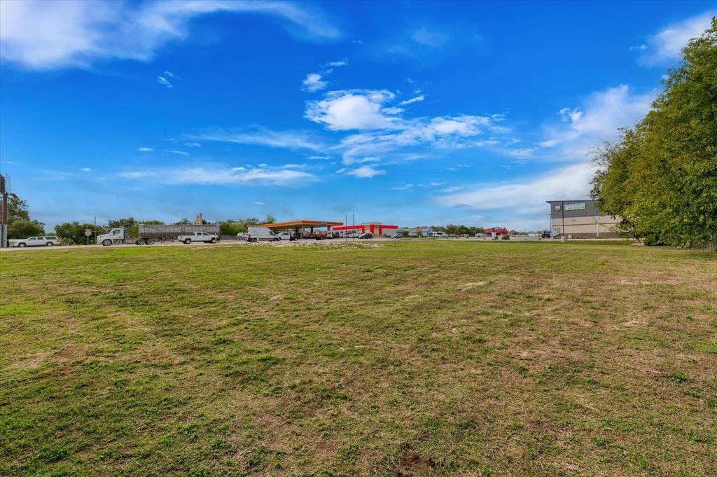 Expansive level lot featuring cleared terrain and mature perimeter trees