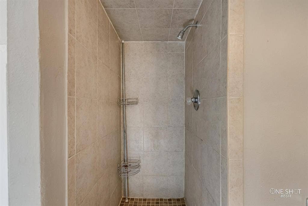 Bathroom with a tile shower