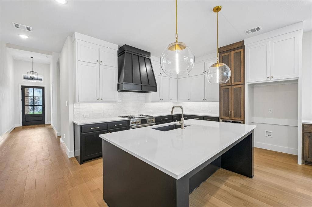 4012 Bentsen Street, McKinney, TX 75071 Gorgeous counter tops, beautiful cabinetry and lovely flooring paired with contemporary stainless steel all combine to create this timeless kitchen!