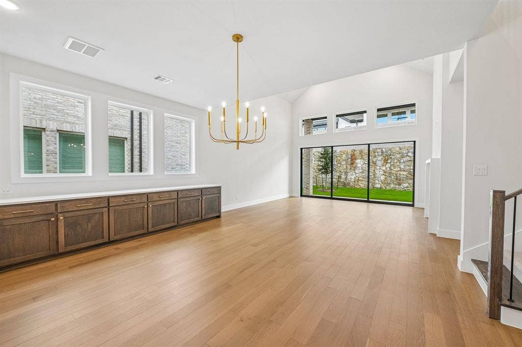 4012 Bentsen Street, McKinney, TX 75071 The spacious light filled dining room offers a row of cabinets creating the ideal serving space when hosting lively dinner parties or family get togethers.