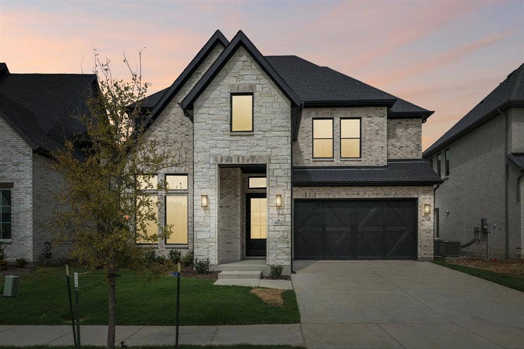 4012 Bentsen Street, McKinney, TX 75071 A dramatic stone entry paired with beautiful light colored brick and dark trim create outstanding curb appeal for this dream home!