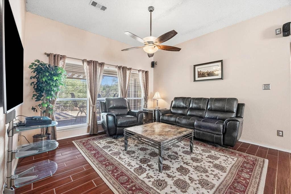 6412 Bluebonnet Drive, Rowlett, TX 75089 Banks of windows provide ample natural lighting