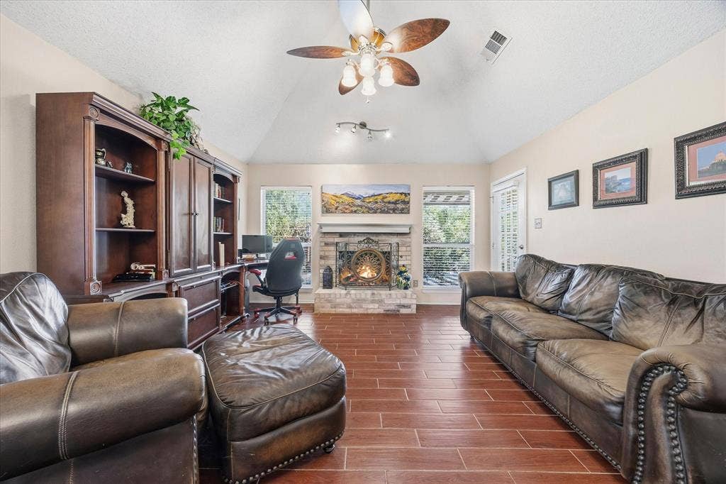 6412 Bluebonnet Drive, Rowlett, TX 75089 Family room includes gorgeous fireplace