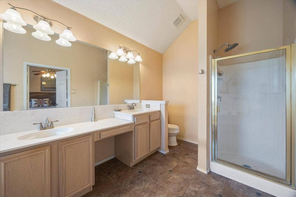 6412 Bluebonnet Drive, Rowlett, TX 75089 Master bath includes his and her vanities with makeup area