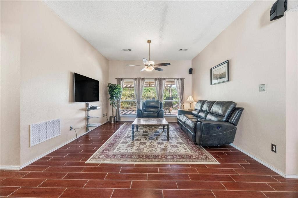 6412 Bluebonnet Drive, Rowlett, TX 75089 Open floor plan features dining area overlooking living area