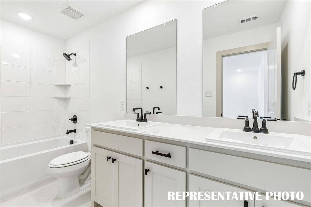 612 Taylor Parkway, Celina, TX 75009 Guests will enjoy their own vanity space in this thoughtfully designed guest bath. REPRESENTATIVE PHOTO