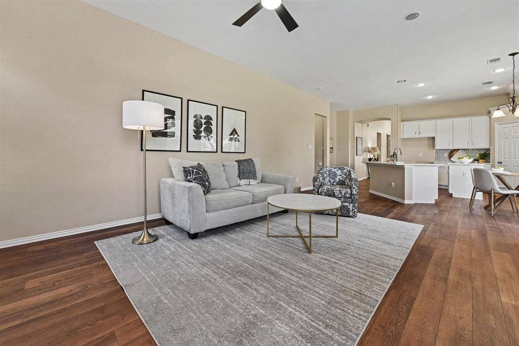 401 Stonebridge Circle, Allen, TX 75013 Spacious den with ceiling fan open to kitchen
