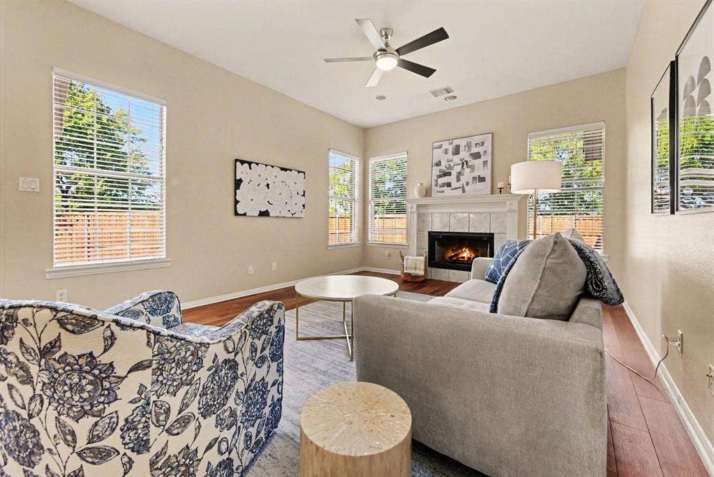 401 Stonebridge Circle, Allen, TX 75013 Den with decorative fireplace and gas logs