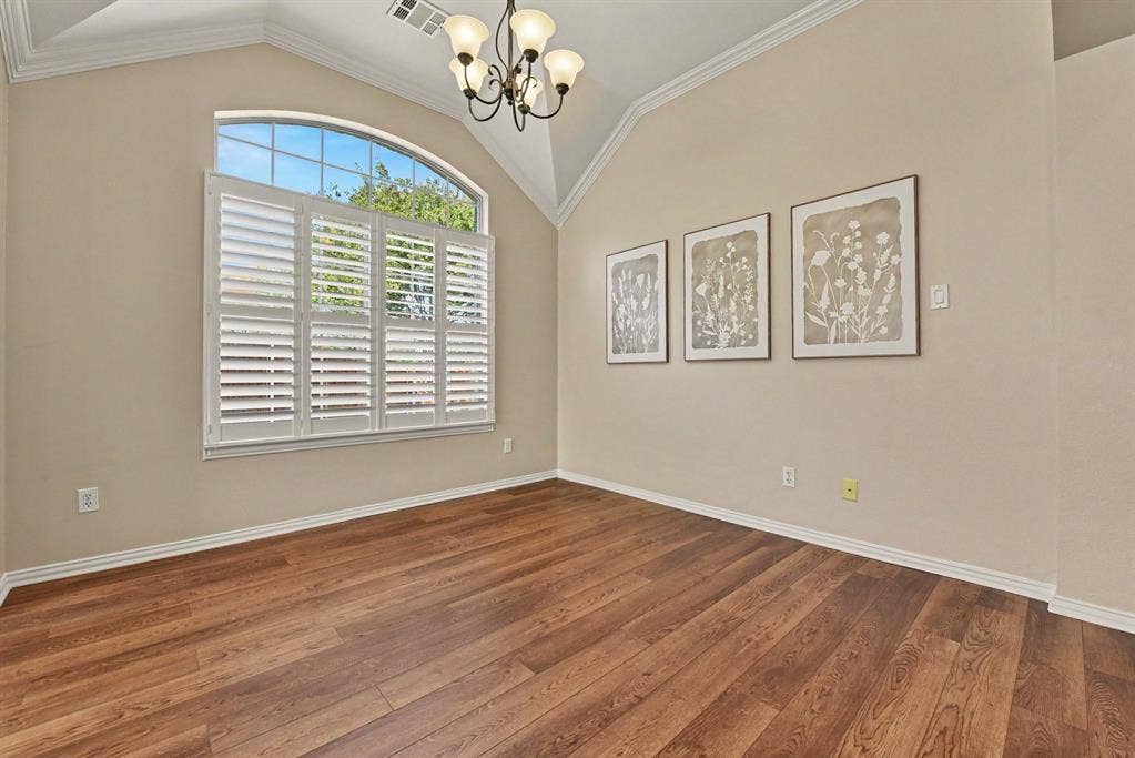 401 Stonebridge Circle, Allen, TX 75013 Dining room with chandelier and shutters