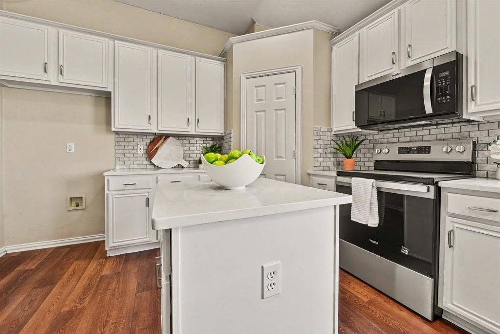 401 Stonebridge Circle, Allen, TX 75013 Kitchen with walk-in pantry, stainless range and microwave