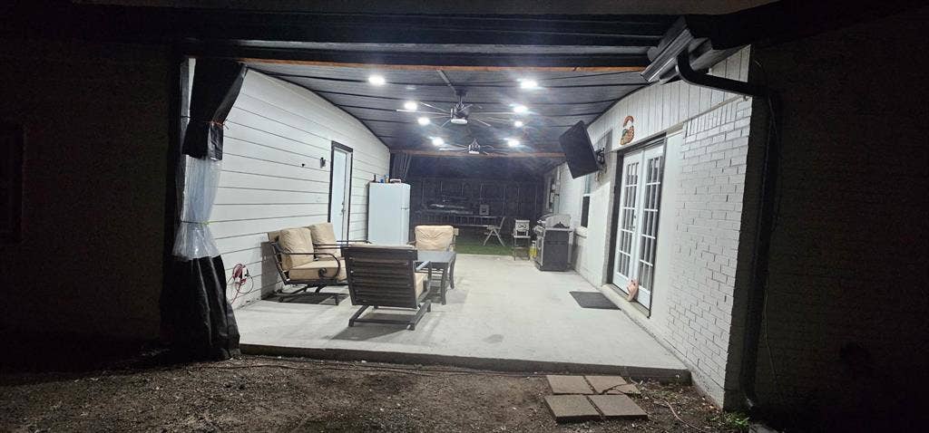 Covered concrete patio featuring recessed lighting, a ceiling fan, and double glass-pane doors