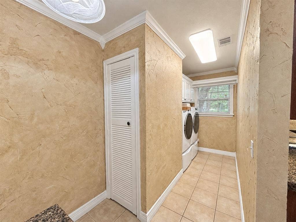 13672 County Road 2915, Eustace, TX 75124 Textured wall finishes, ceramic tile flooring, louvered-style built-in cabinetry, and crown molding