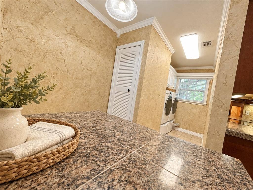 13672 County Road 2915, Eustace, TX 75124 Tiled countertop, textured wall finish, louvered-panel door, and crown molding