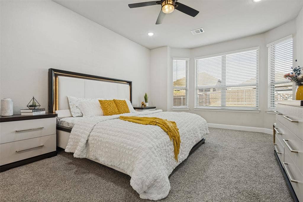 5313 Pratt Circle, McKinney, TX 75071 Room featuring a bay window, wall-to-wall carpeting, recessed lighting, and a ceiling fan