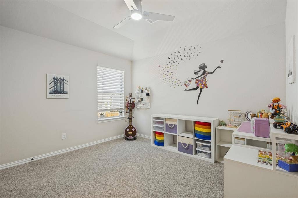 5313 Pratt Circle, McKinney, TX 75071 Room featuring a vaulted ceiling, neutral wall tones, wall-to-wall carpeting, a window with horizontal blinds, and a white ceiling fan with integrated lighting