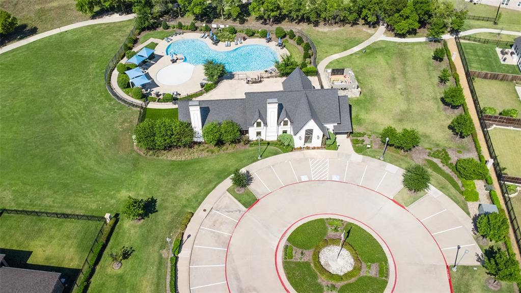 2971 Gaulding Drive, Prosper, TX 75078 Community facility featuring an outdoor swimming pool, paved circular parking area, expansive manicured grounds, and mature landscaping
