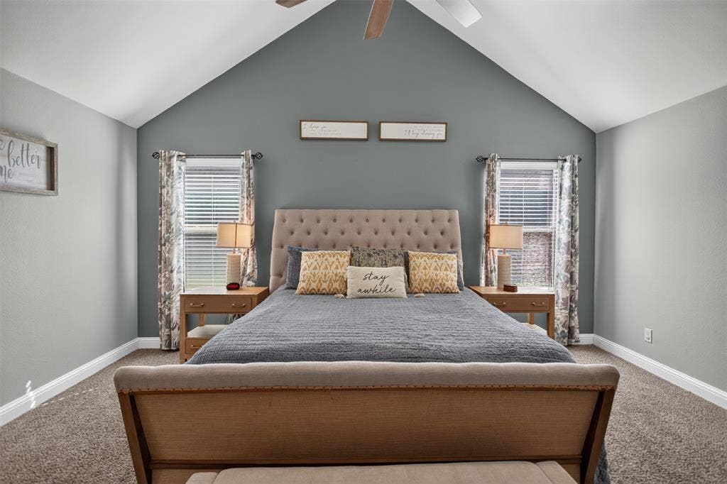 122 Anns Way, Forney, TX 75126 Vaulted ceiling with a central paddle fan, dual windows, and wall-to-wall carpeting