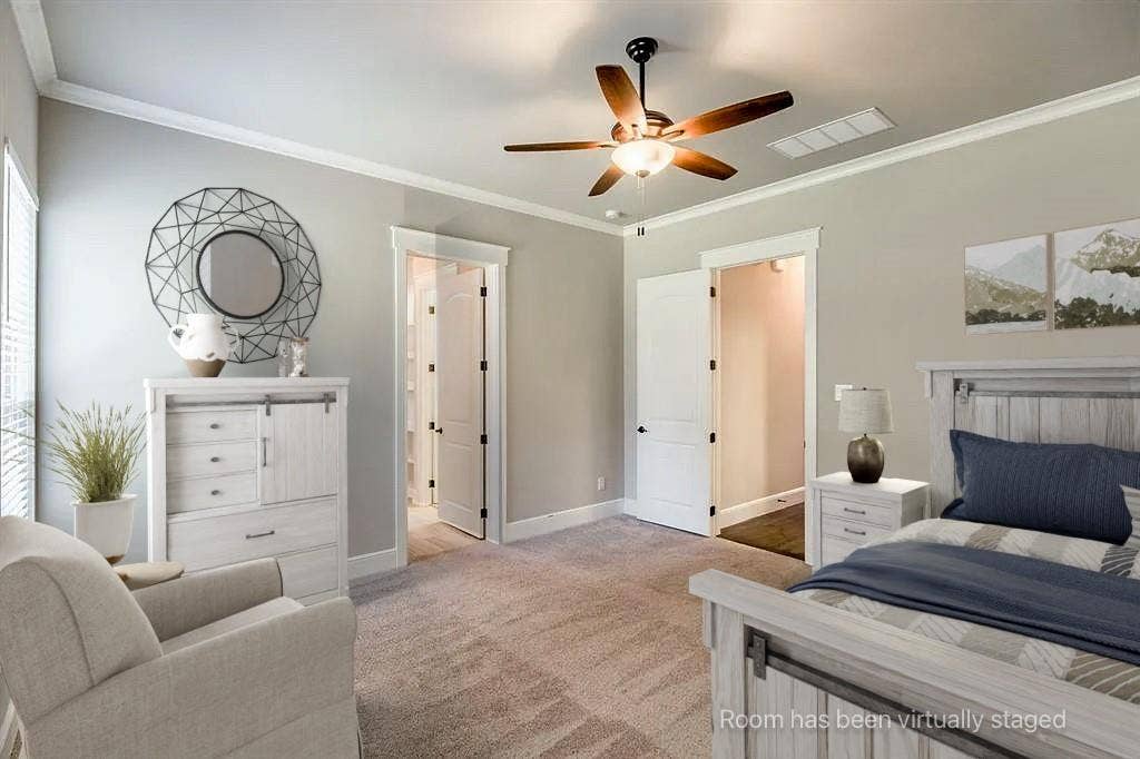 336 Kaye Street, Coppell, TX 75019 Neutral-toned bedroom featuring carpeting, multi-blade ceiling fan with integrated lighting, and crown molding