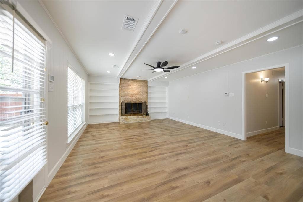 4333 Harvest Hill Road, Dallas, TX 75244 Living area featuring wood-finish flooring, a masonry fireplace with built-in shelving, recessed lighting, and a ceiling fan